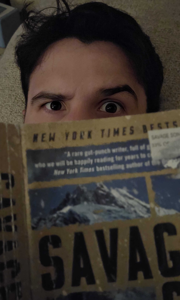 T.H. reading Jack Carr's Savage Son